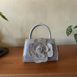 Elegant Silver Handbag with Floral Accent
